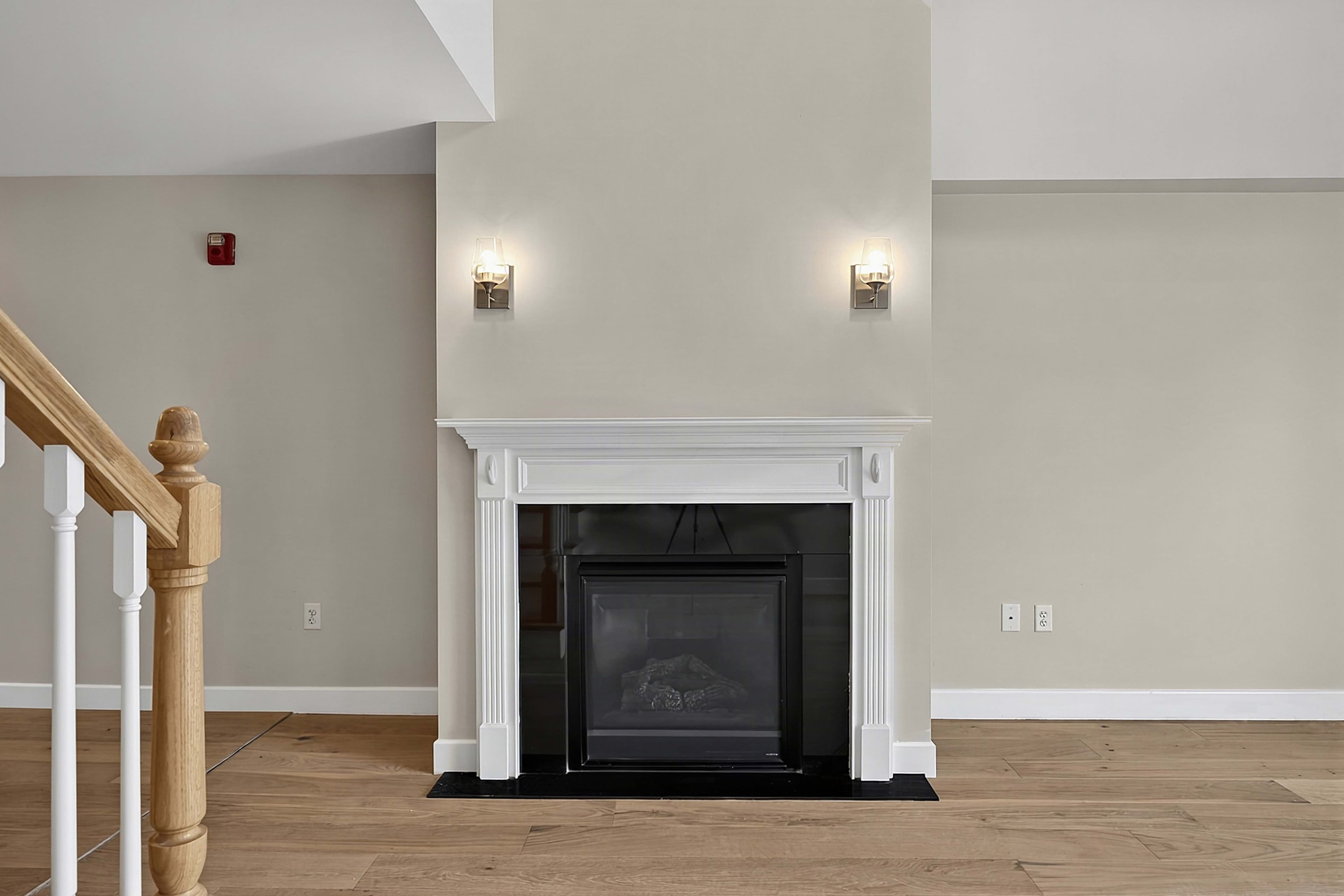 Gas fireplace beside the staircase in the living room