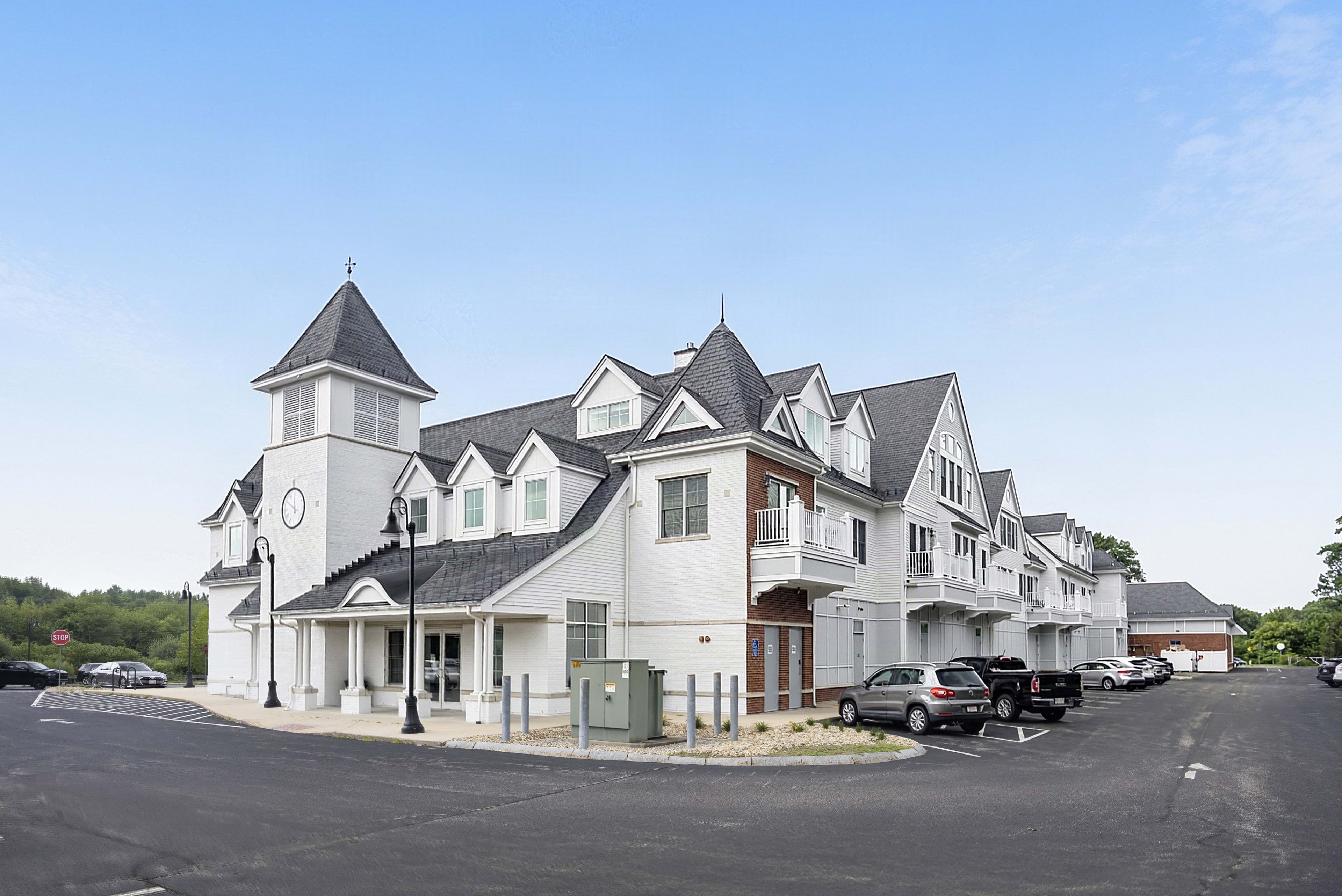 Wide view of the residential wing, clock tower, and balconies
