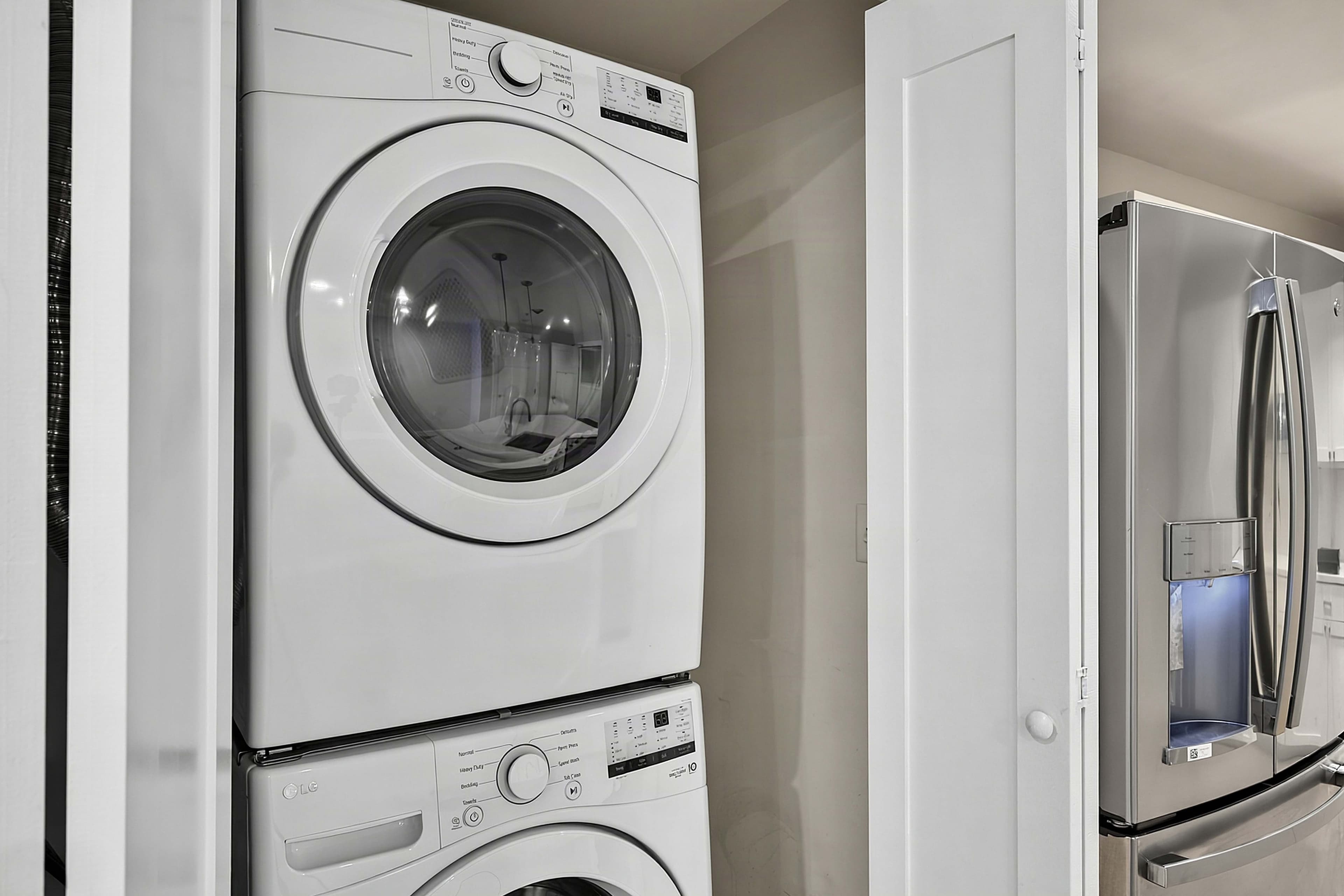 Stacked washer and dryer in the apartment laundry closet