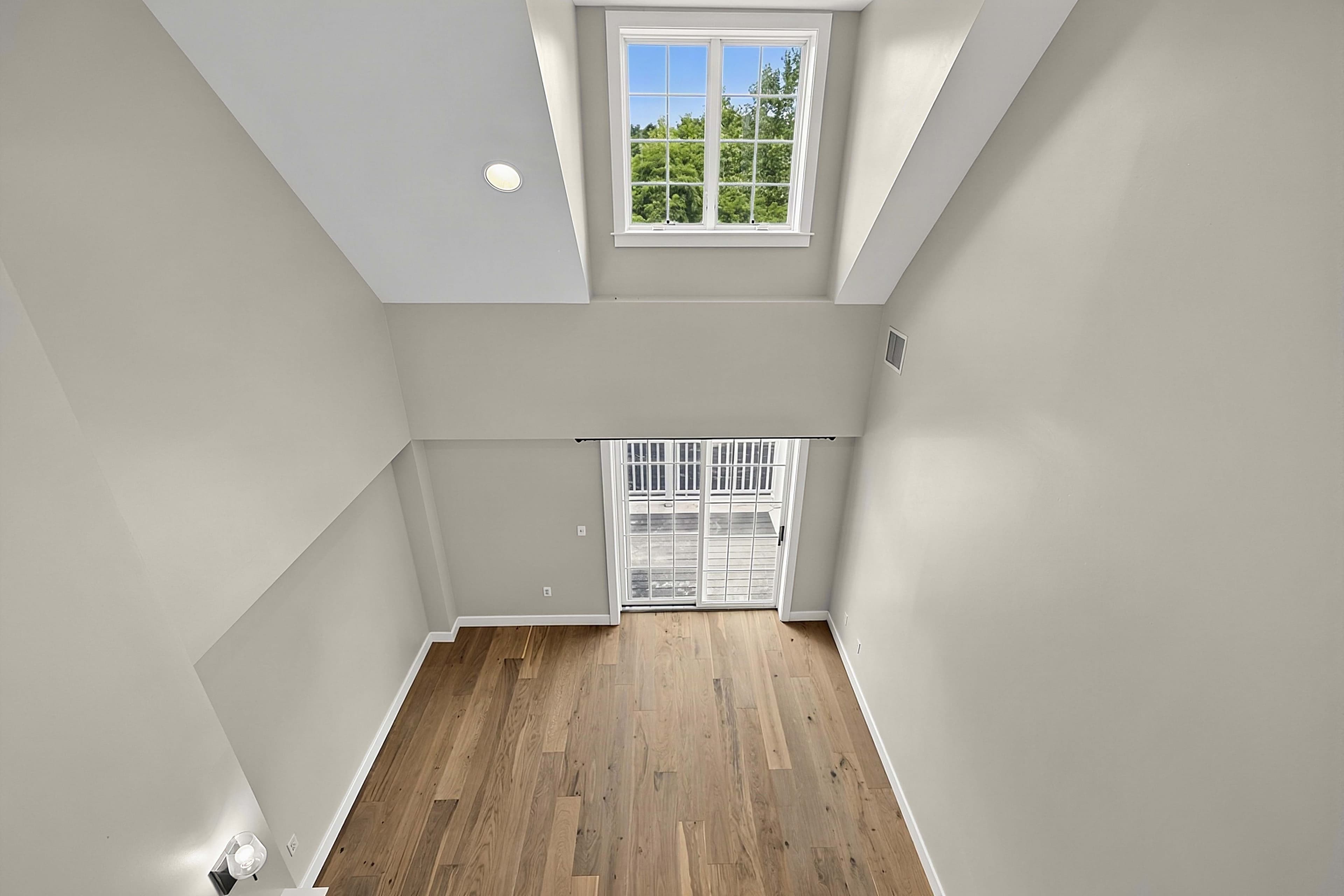 View from the upper landing into the double-height living room