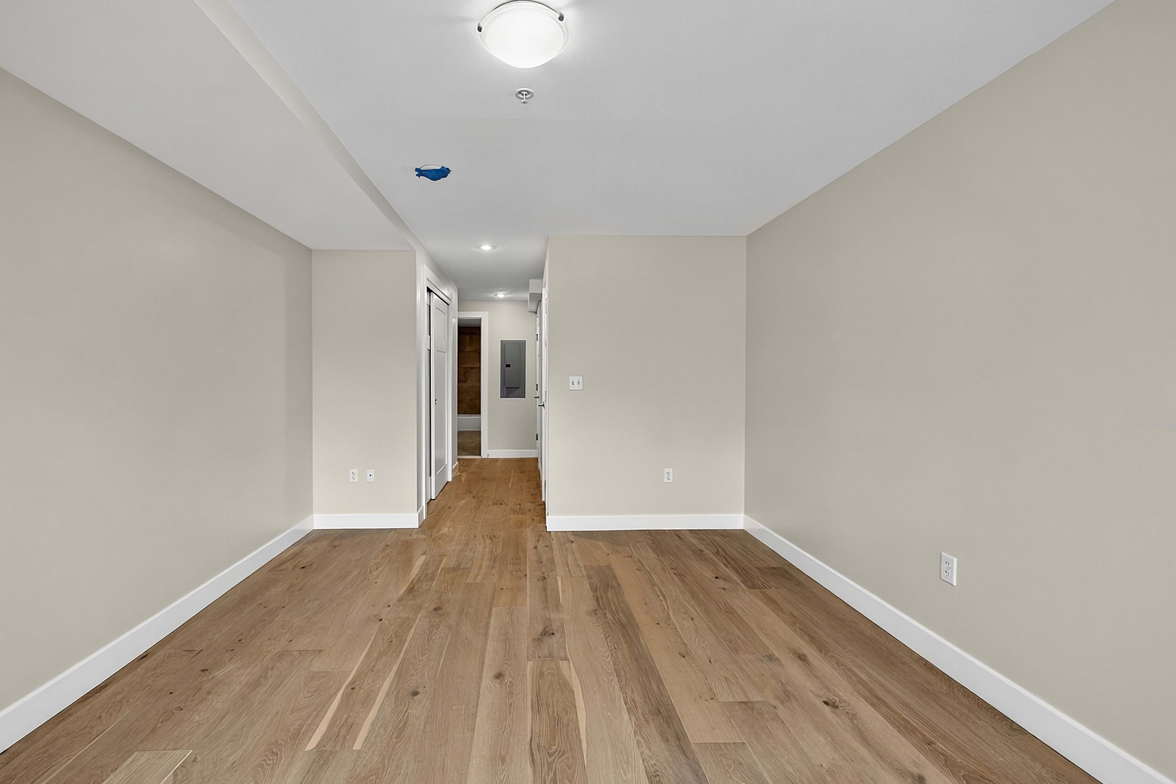 Unfurnished private room viewed toward the hallway