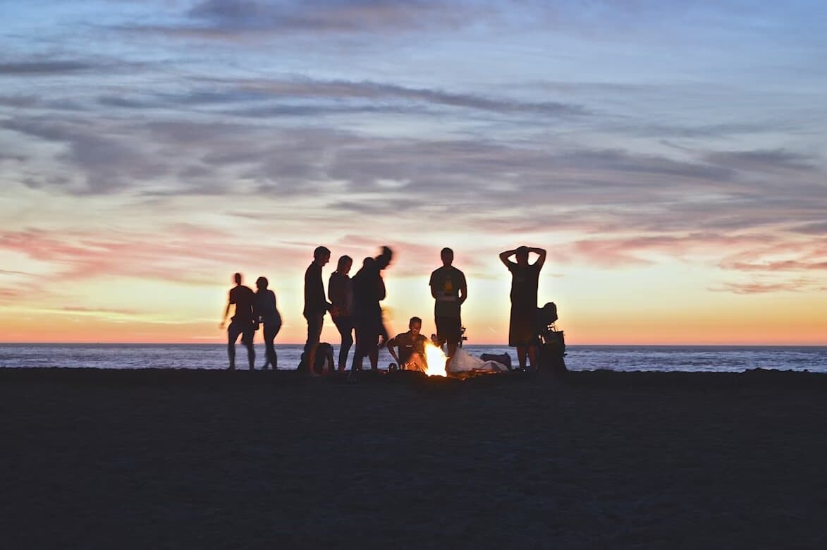 A group of people on a sunset